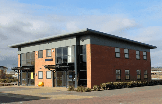 Modern commercial building in Southern Maine protected by Precision Pest Control services